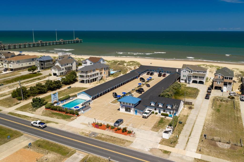 an aerial view of a house and the beach at Dolphin Oceanfront Motel - Nags Head in Nags Head