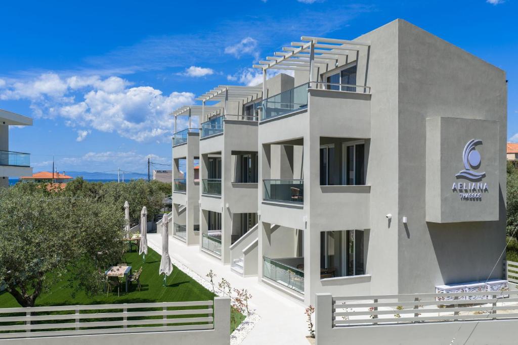 a rendering of a white building with the ocean in the background at Aeliana Thassos Studios & Lofts in Skala Rachoniou
