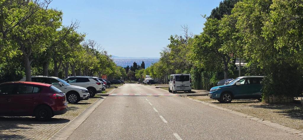 a group of cars parked on the side of a road at Studio Rose in Gajac