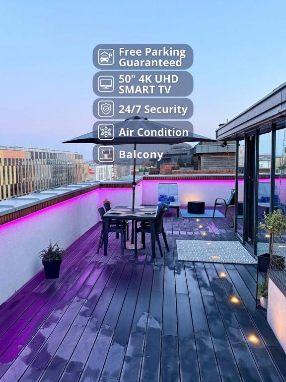 a patio with a table on top of a building at Angel MINT Apartment - FREE PARKING - Balcony in Krakow