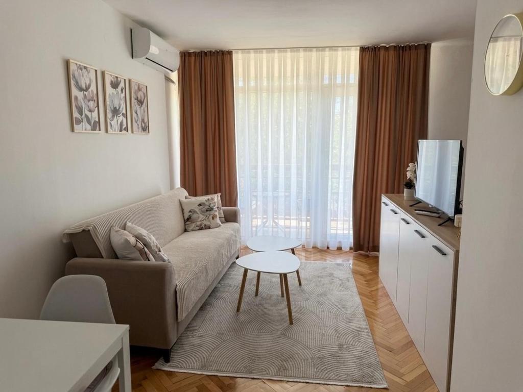 a living room with a couch and a table at Angel's Residence in Veles