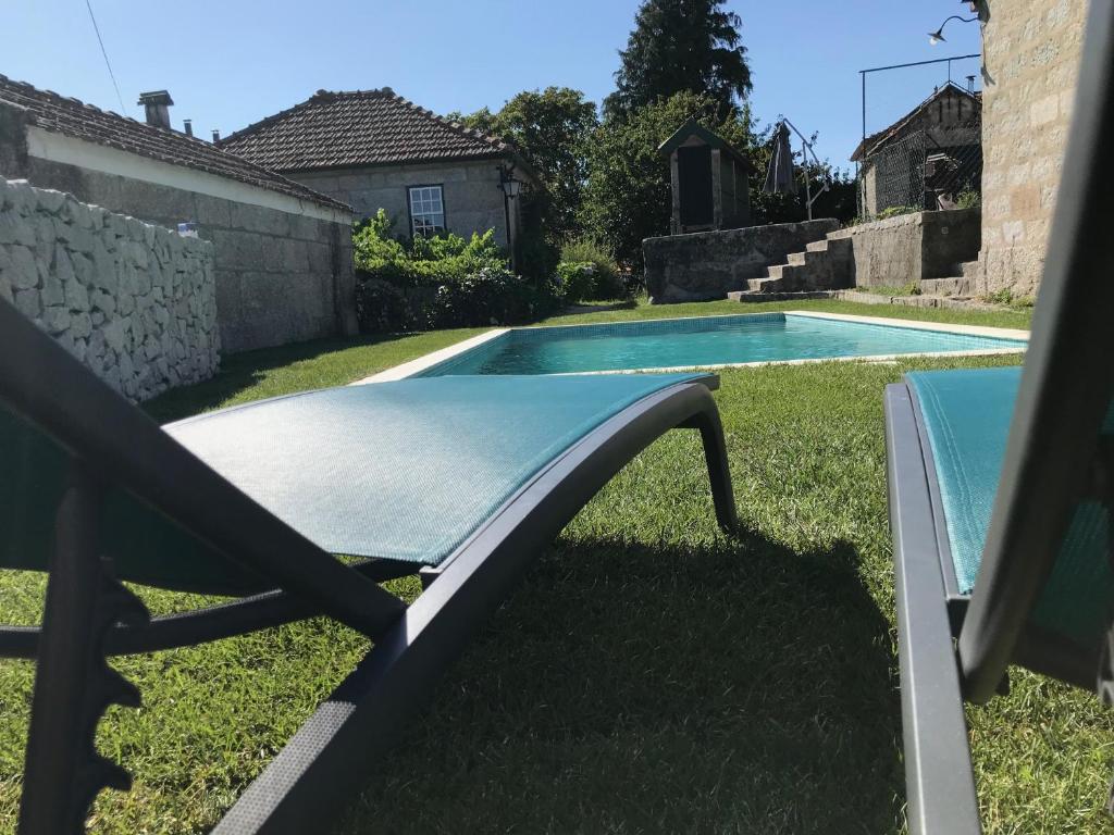 a swimming pool in the backyard of a house at Casa da Ponte in Baião