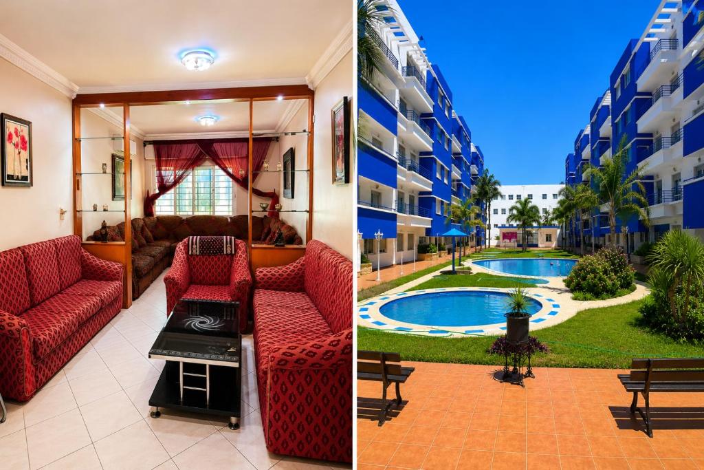 a living room with red furniture and a swimming pool at Spacious Family Apartment - Air Conditioning, Pool & Garden Views in Martil