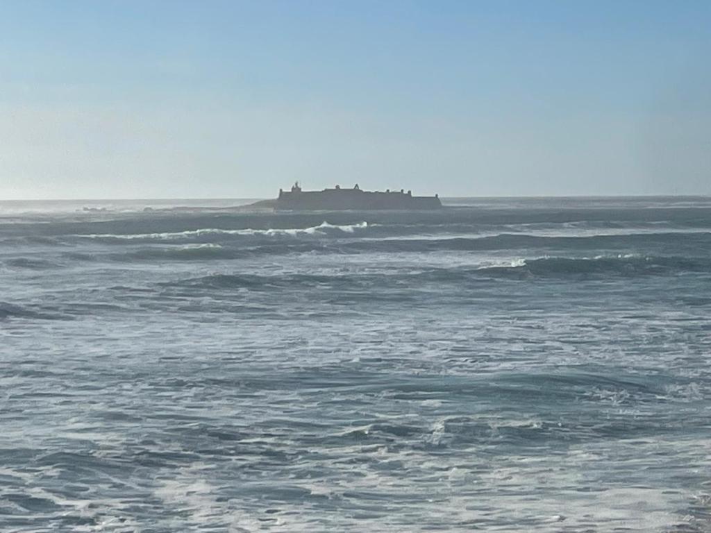 a large ship in the ocean with at Casa do Pai in Vila Praia de Âncora