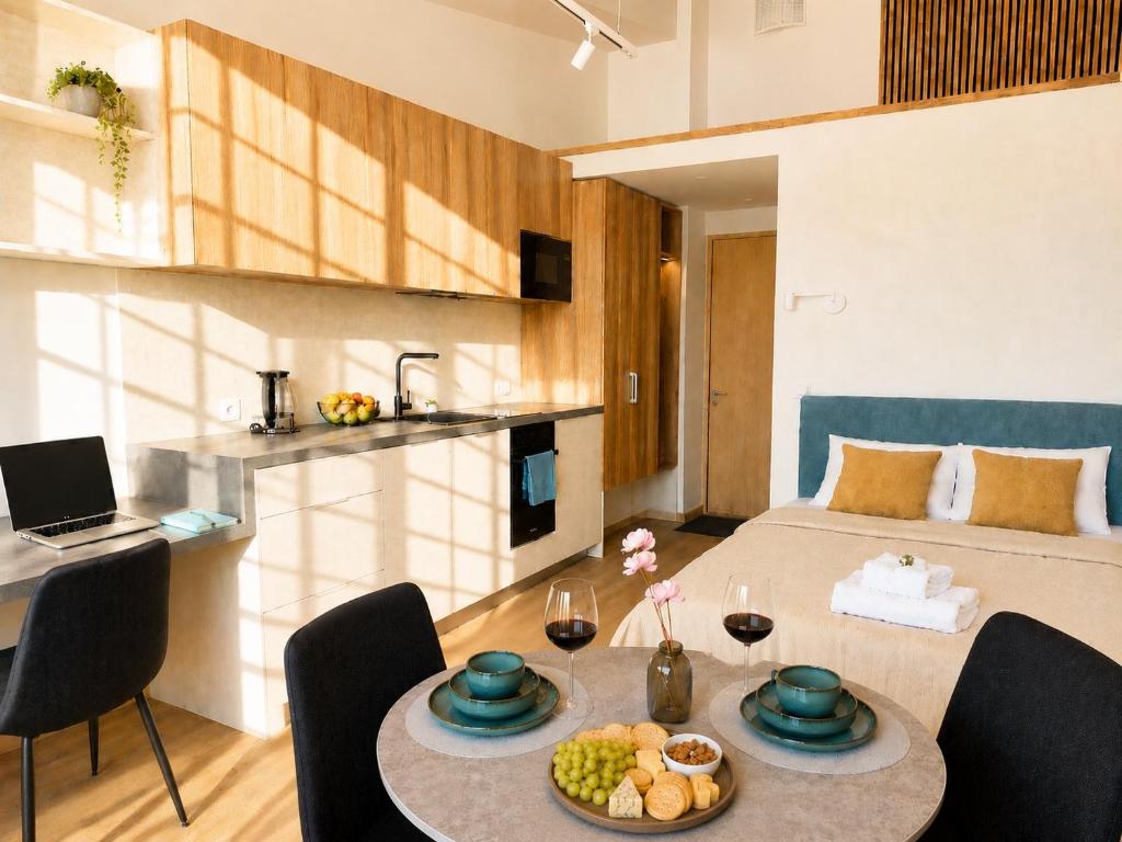 a living room with a table and a bed at Emajõe Apartments in Tartu