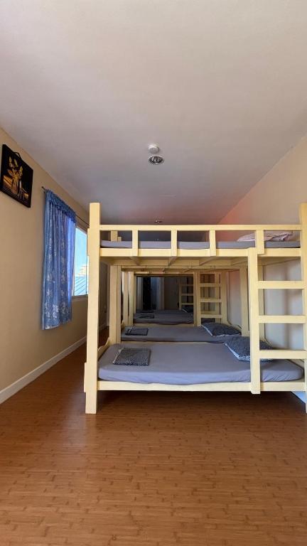 a bunk bed room with two bunk beds at Buku island in san juan la union