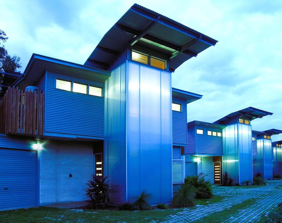 a blue house with lights on it at Fishers Villa - Crescent Head in Crescent Head