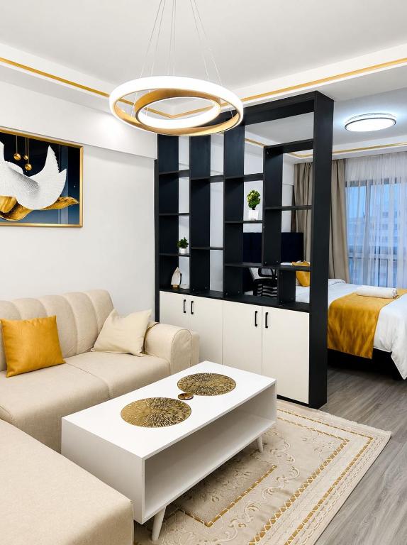 a living room with a couch and a table at Alina Ridge in Nairobi