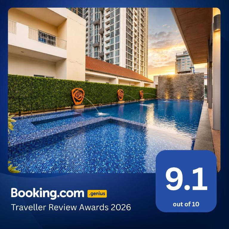 a swimming pool in the middle of a building at Dazzle Residence Sukhumvit Bangkok in Bangkok
