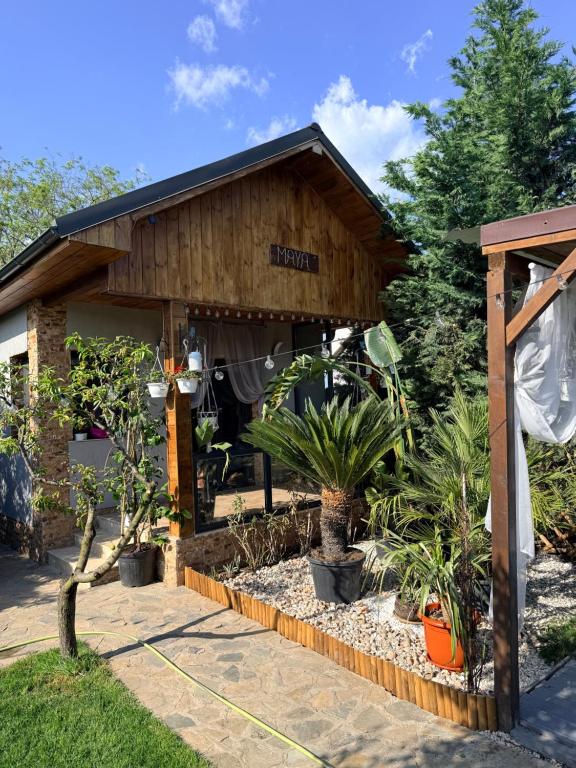 a building with plants in front of it at Cabana Maya in Corbu