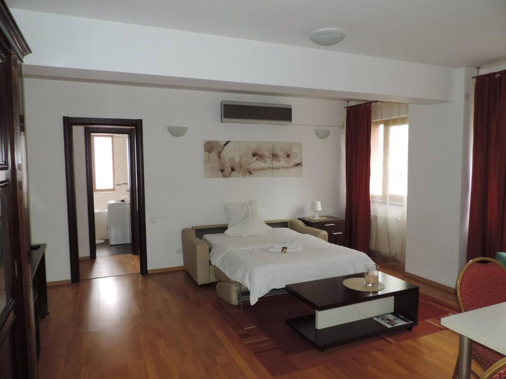 Postel nebo postele na pokoji v ubytování Monte Carlo Palace Suites