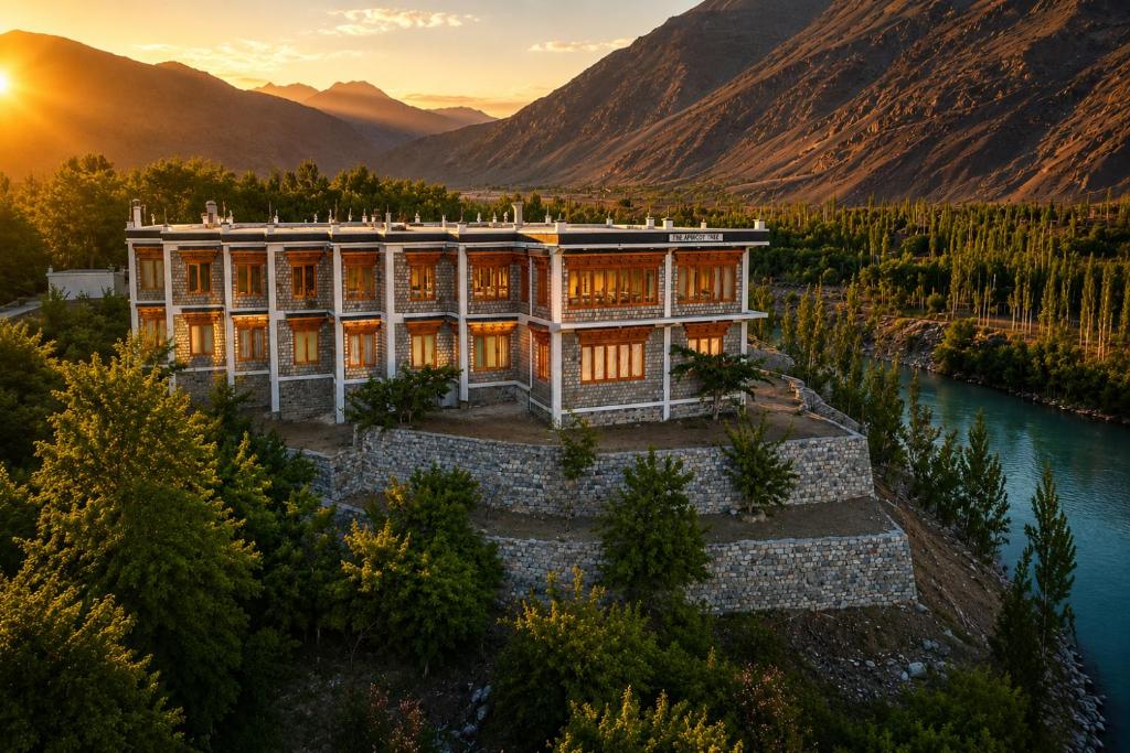 an aerial view of a building next to a river at The Apricot Tree Hotel in Nūrla