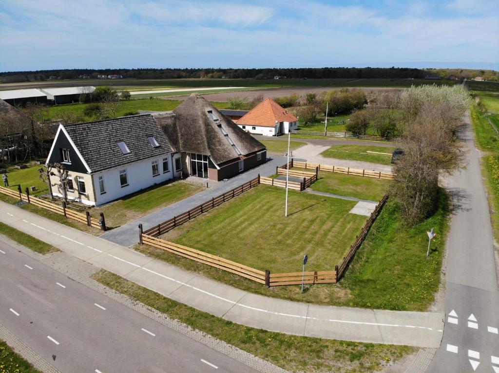 an aerial view of a house and a road at B&B Lindehoeve Texel in Den Hoorn