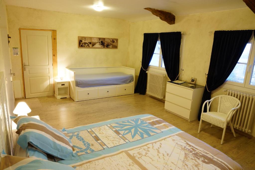 Postel nebo postele na pokoji v ubytování Un Coin de Paradis