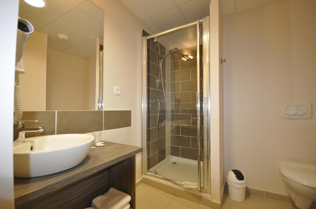 Koupelna v ubytování Hotel Caiman