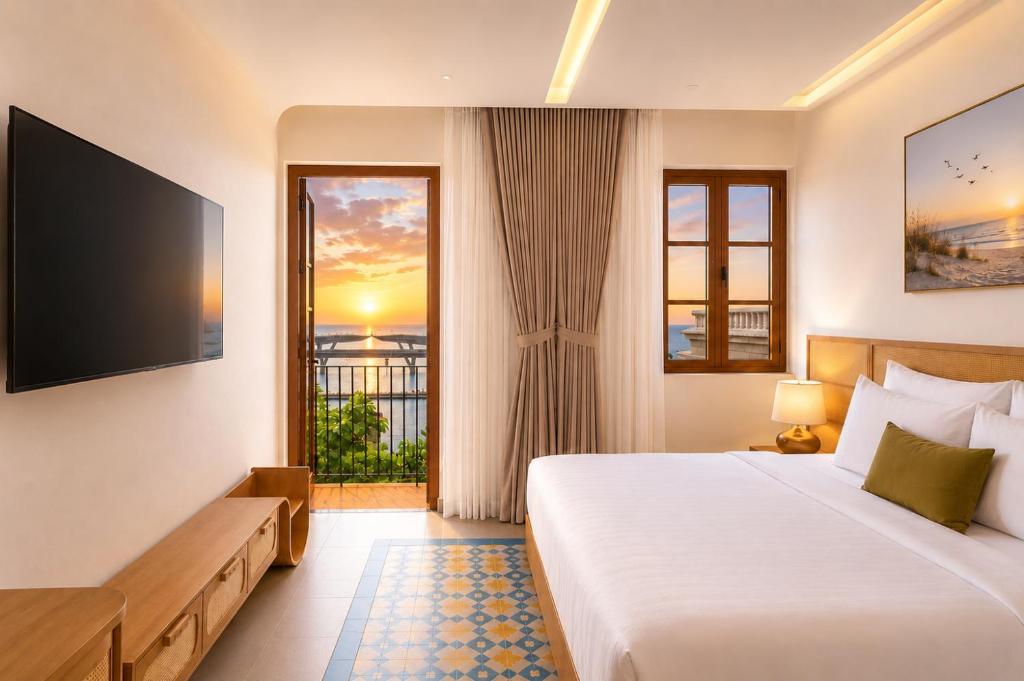 a hotel room with a bed and a large window at Noska Hotel Sunset Town Sea View & Fireworks in Phú Quốc