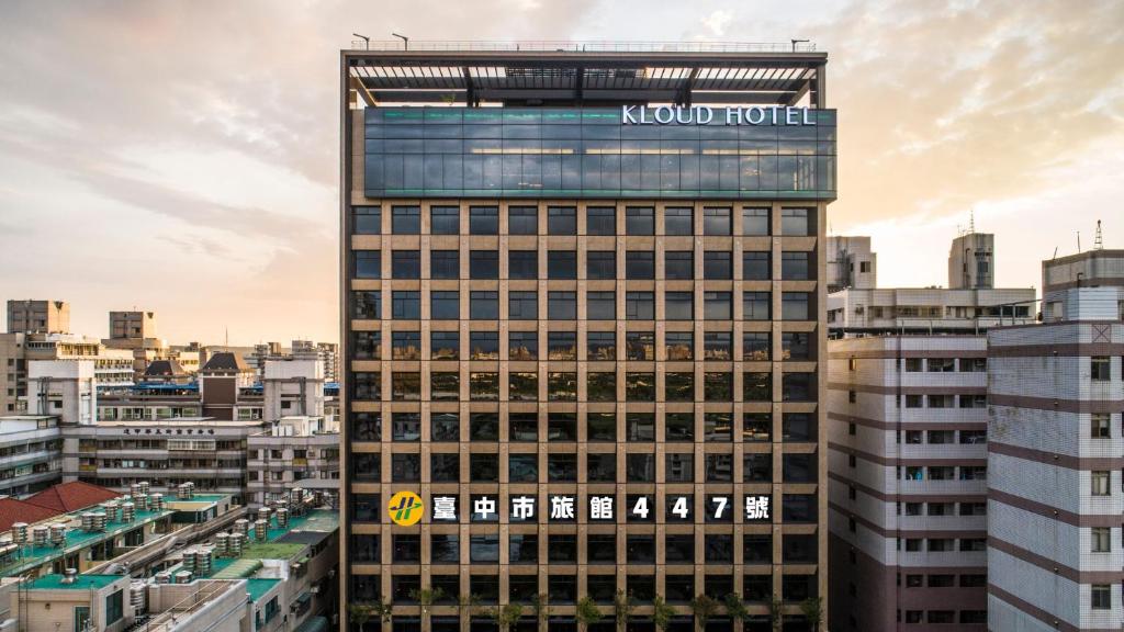 a building with a sign on the top of it at Kloud Hotel in Taichung