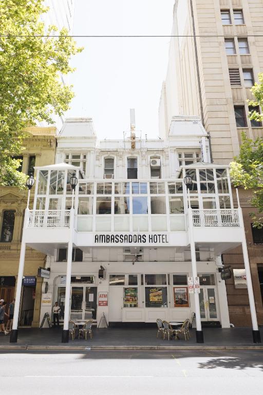 a white building with a sign that readsurdos hotel at Ambassadors Hotel in Adelaide