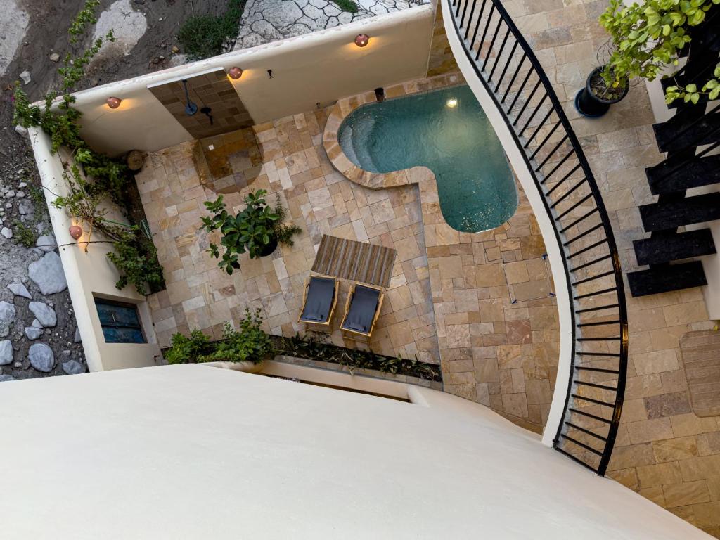 an overhead view of a house with a swimming pool at Betham Chalet in Nizwa