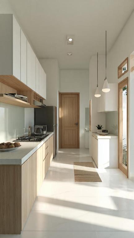 a kitchen with white cabinets and a counter top at the ockta omeah 2 in Semenyih