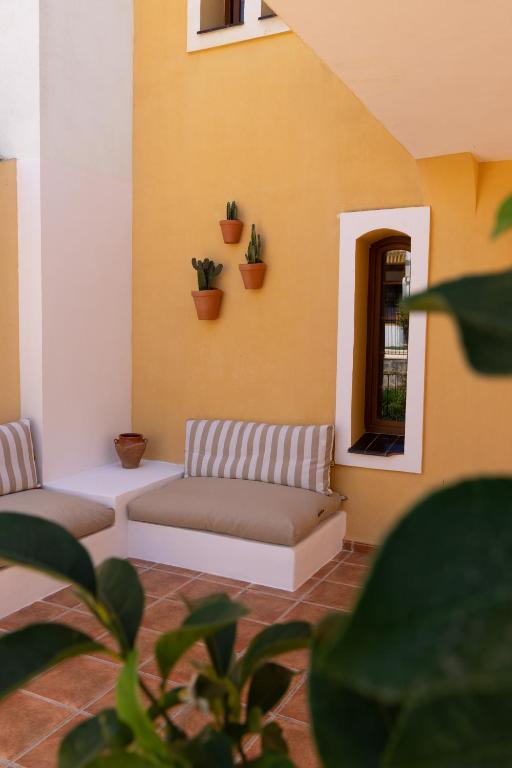 a living room with a couch and a window at La Manga Amarilla in Cartagena