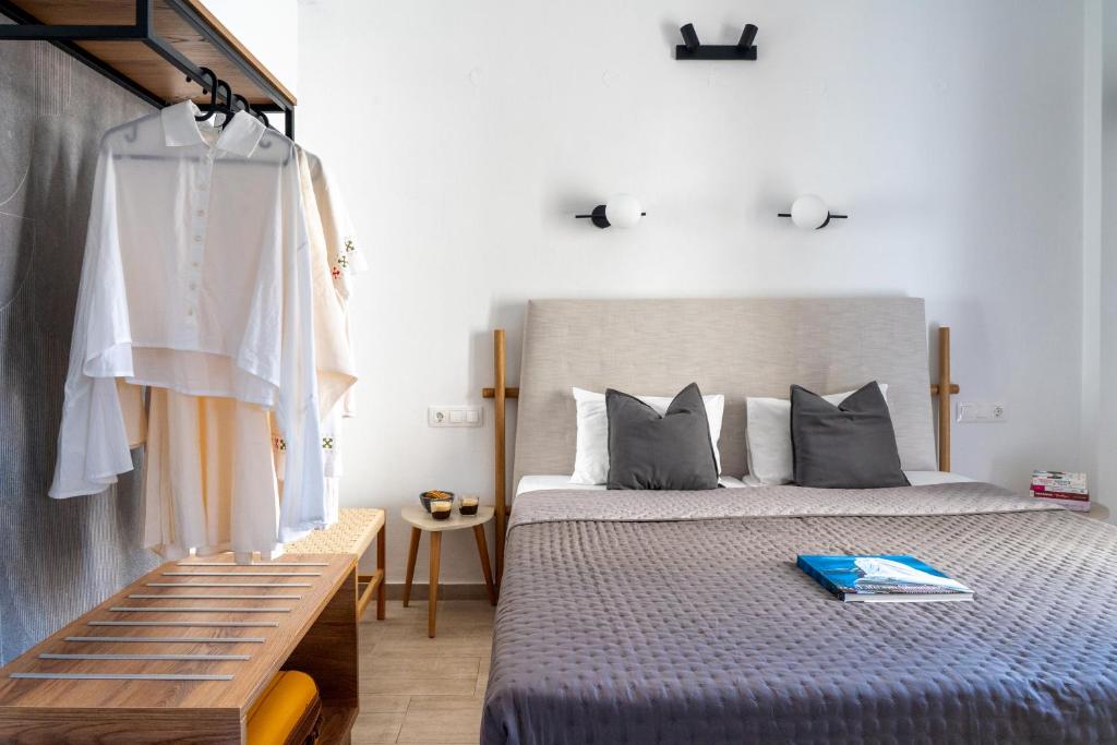 a bedroom with a large bed and a window at Central Guest House Skiathos in Skiathos