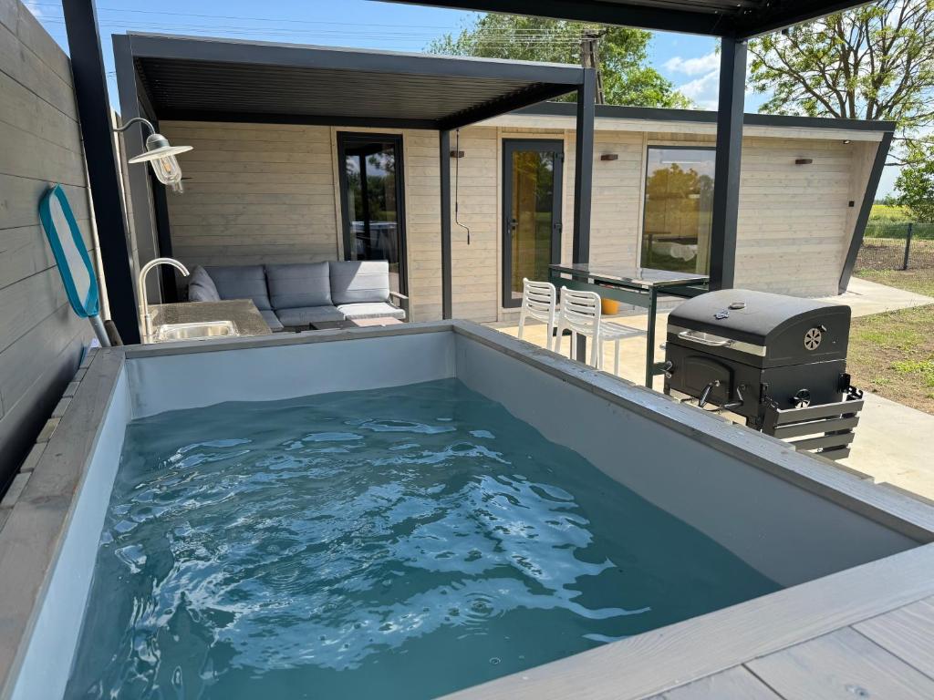 a swimming pool in the backyard of a house at ChillHouse 2 in Békésszentandrás