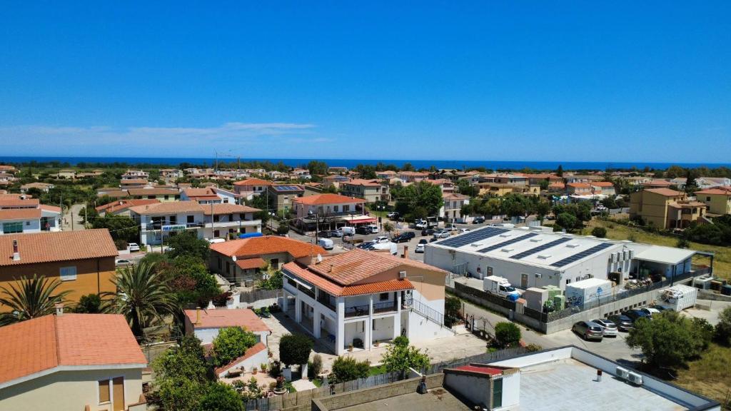 an aerial view of a small town with buildings at Le case di Helga in Budoni