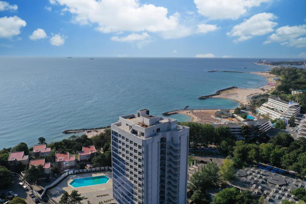an aerial view of a building next to the ocean at Olimp Panoramic Sea View in Olimp