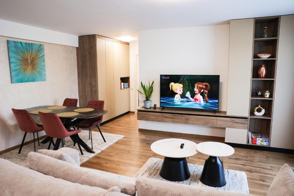 a living room with a couch and a table at AMA Residence Premium Apartment in Târgu-Mureş