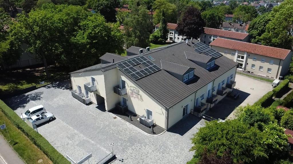 an overhead view of a house with solar panels on the roof at Boardinghouse Schellenberg in Donauwörth