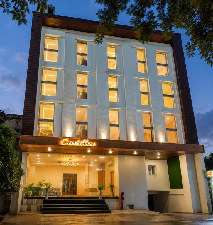 a building with a sign that reads carolina at PerfectStayz Premium Cadillac in Varanasi