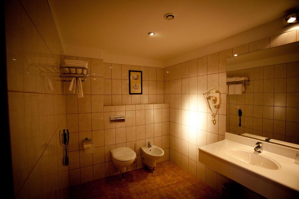 Koupelna v ubytování Hotel Maxim
