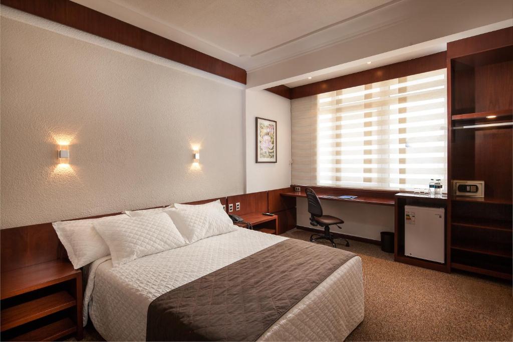 Postel nebo postele na pokoji v ubytování Hotel Cortez