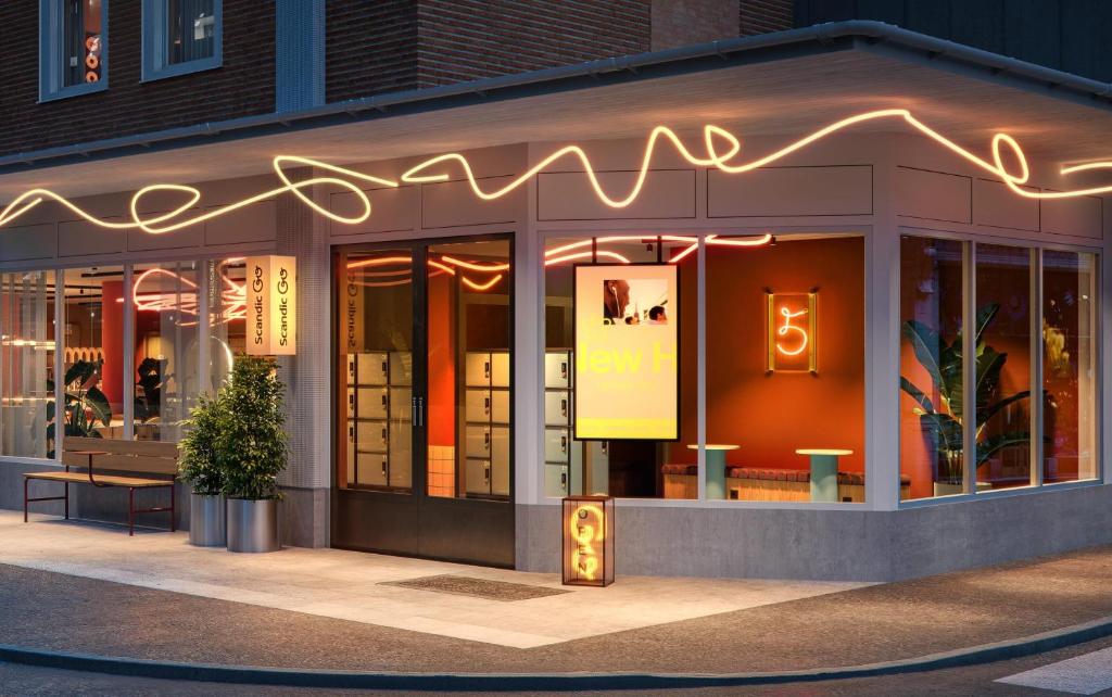a restaurant with a neon sign on the front of it at Scandic Go, Kungsgatan 14 in Jönköping
