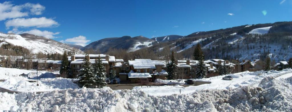 a resort in the mountains covered in snow at Sandstone Creek Club Condominiums in Vail