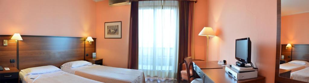 Postel nebo postele na pokoji v ubytování Hotel Bel Sit