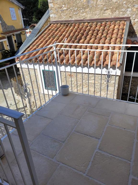 a balcony with a metal fence and a building at Il Borghetto in Palinuro