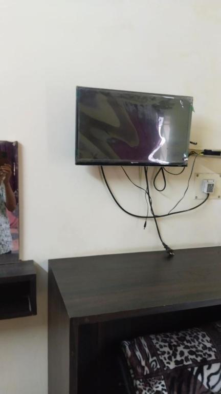 a flat screen tv hanging on a wall at priyadarshi in Digha