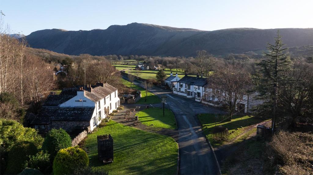an aerial view of a village with houses and a road at Strands Hotel/Screes Inn & Micro Brewery in Nether Wasdale