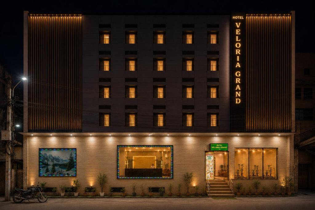 a building with lights on the front of it at Hotel Veloria Grand IGI Airport Delhi in New Delhi