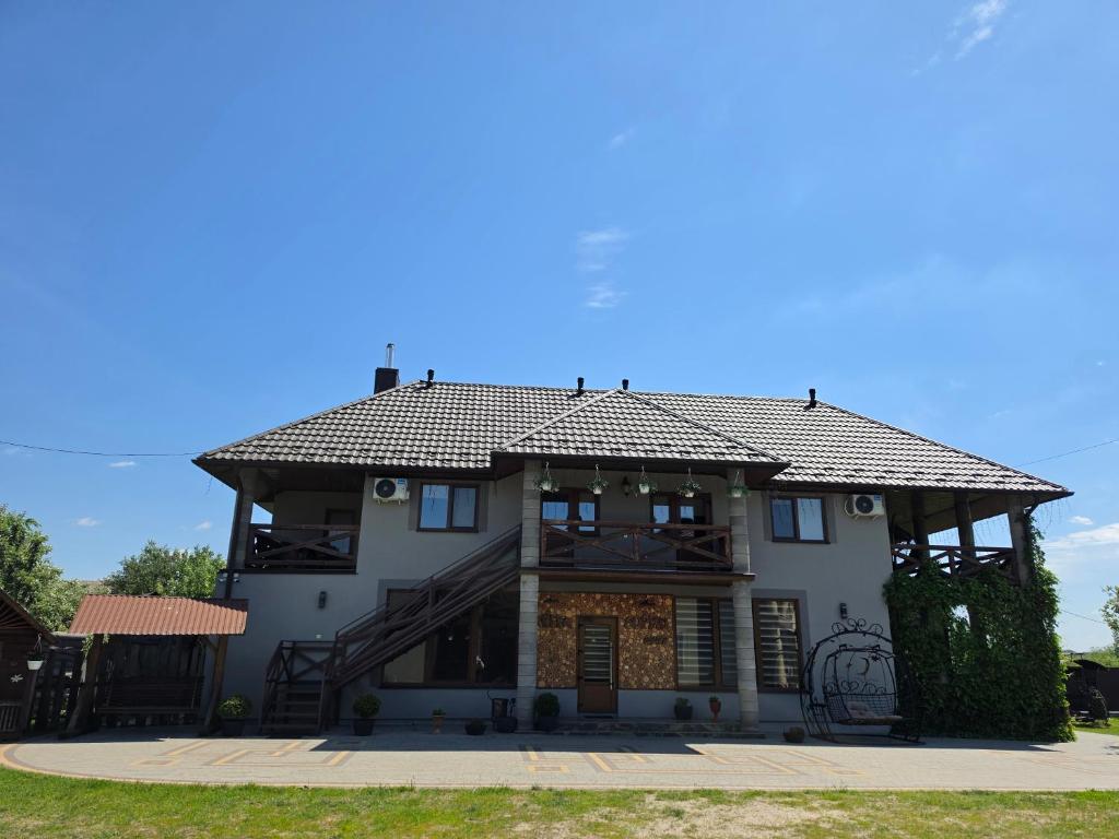 a large white house with a roof at Sopko rest in Svityazʼ