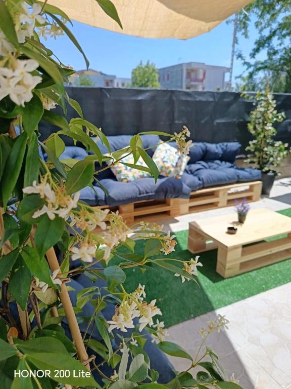 a living room with a blue couch and a coffee table at Vacanze da Paola in Campomarino