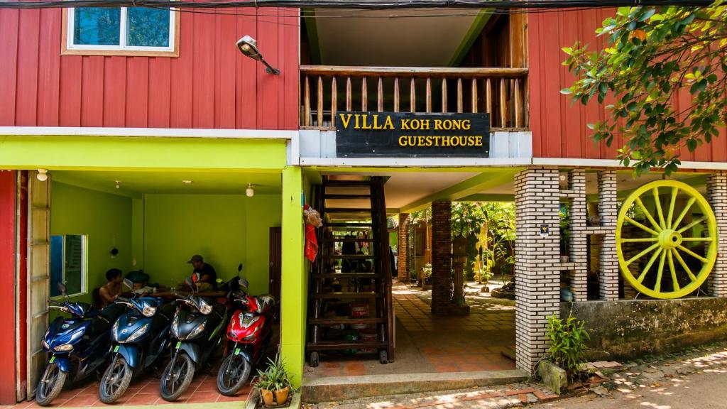 a group of motorcycles parked outside of a building at Villa Koh Rong in Koh Rong Island