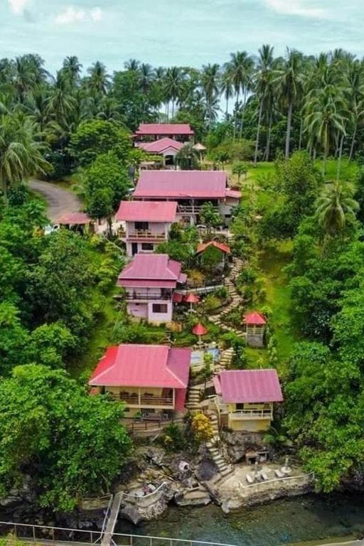 an aerial view of a resort with red roofs at D & A Seaside Cottages in Catarman