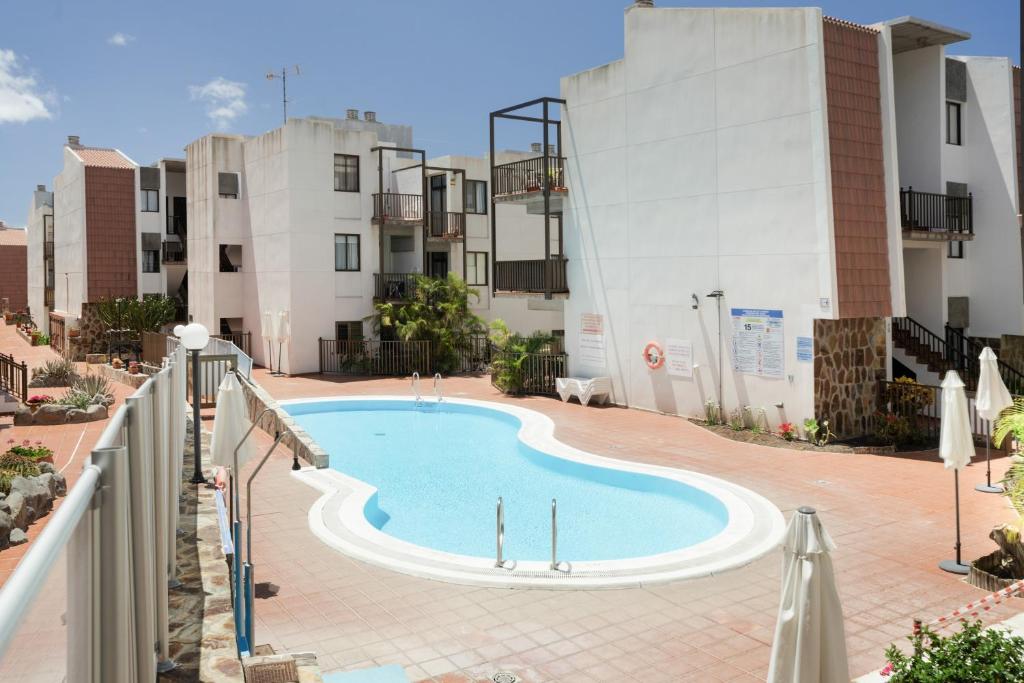 a swimming pool in the middle of a building at Casa Perla in Playa de Santiago