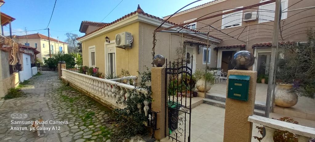a house with a fence in front of a street at Maria,s house in Petra