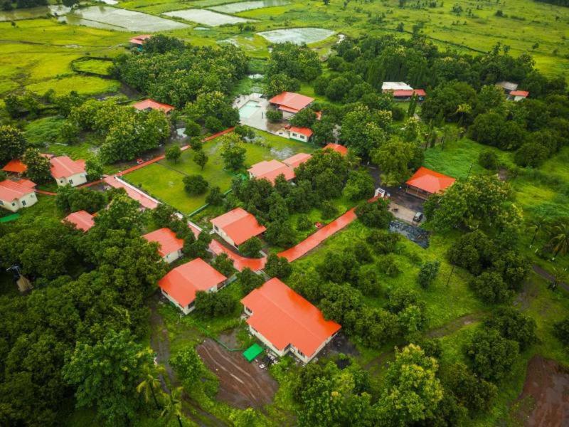 an overhead view of a house with red roofs at Teak Resort Karjat in Karjat