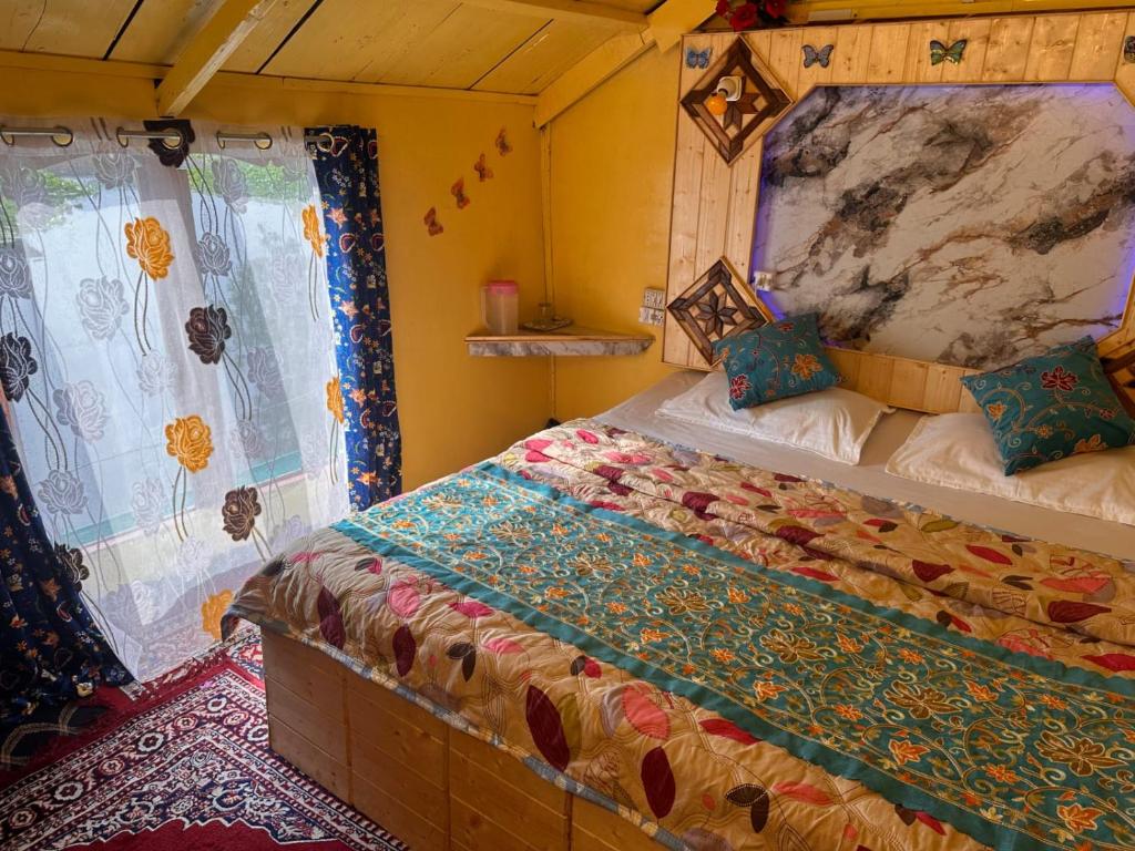 a bedroom with a large bed in a room at H.B Rocket paradise in Srinagar
