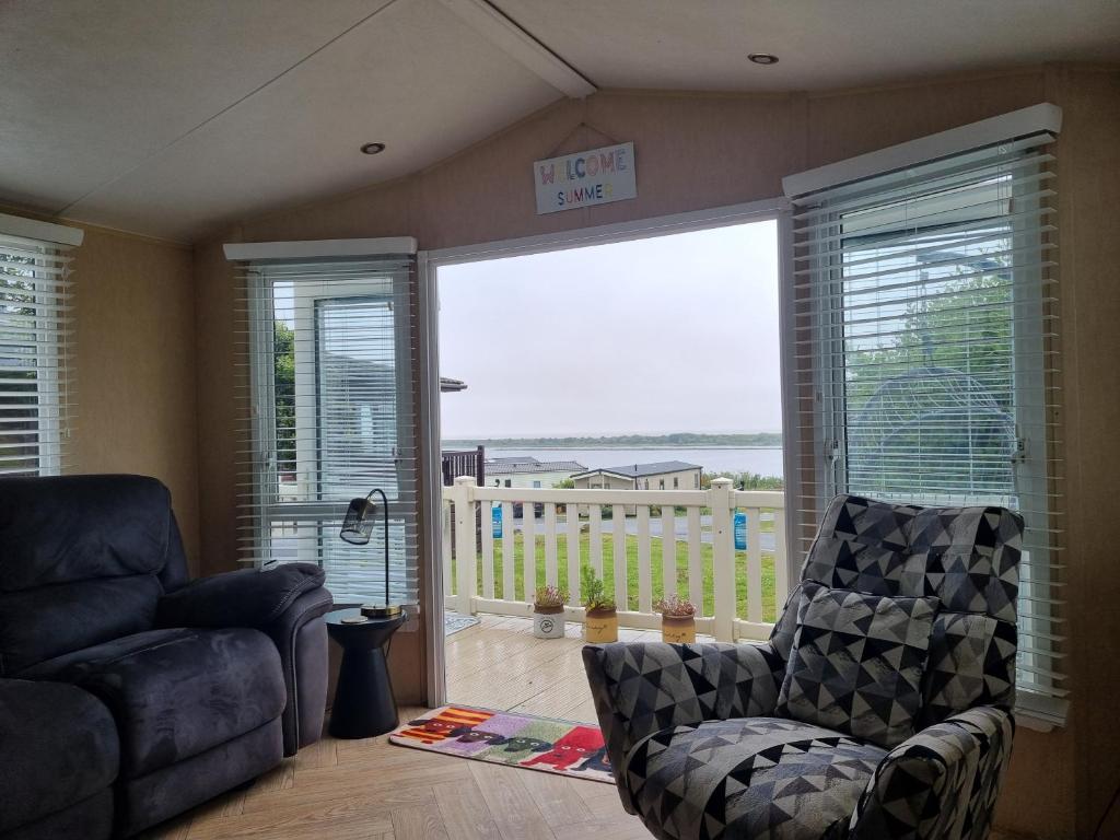 a living room with a couch and a chair at The View in Millom